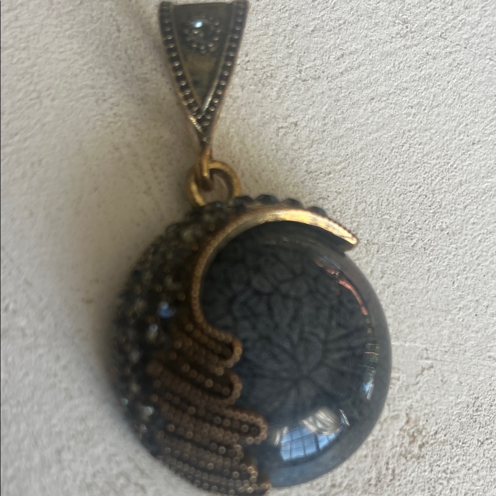 Elegant Gold and Black Pendant